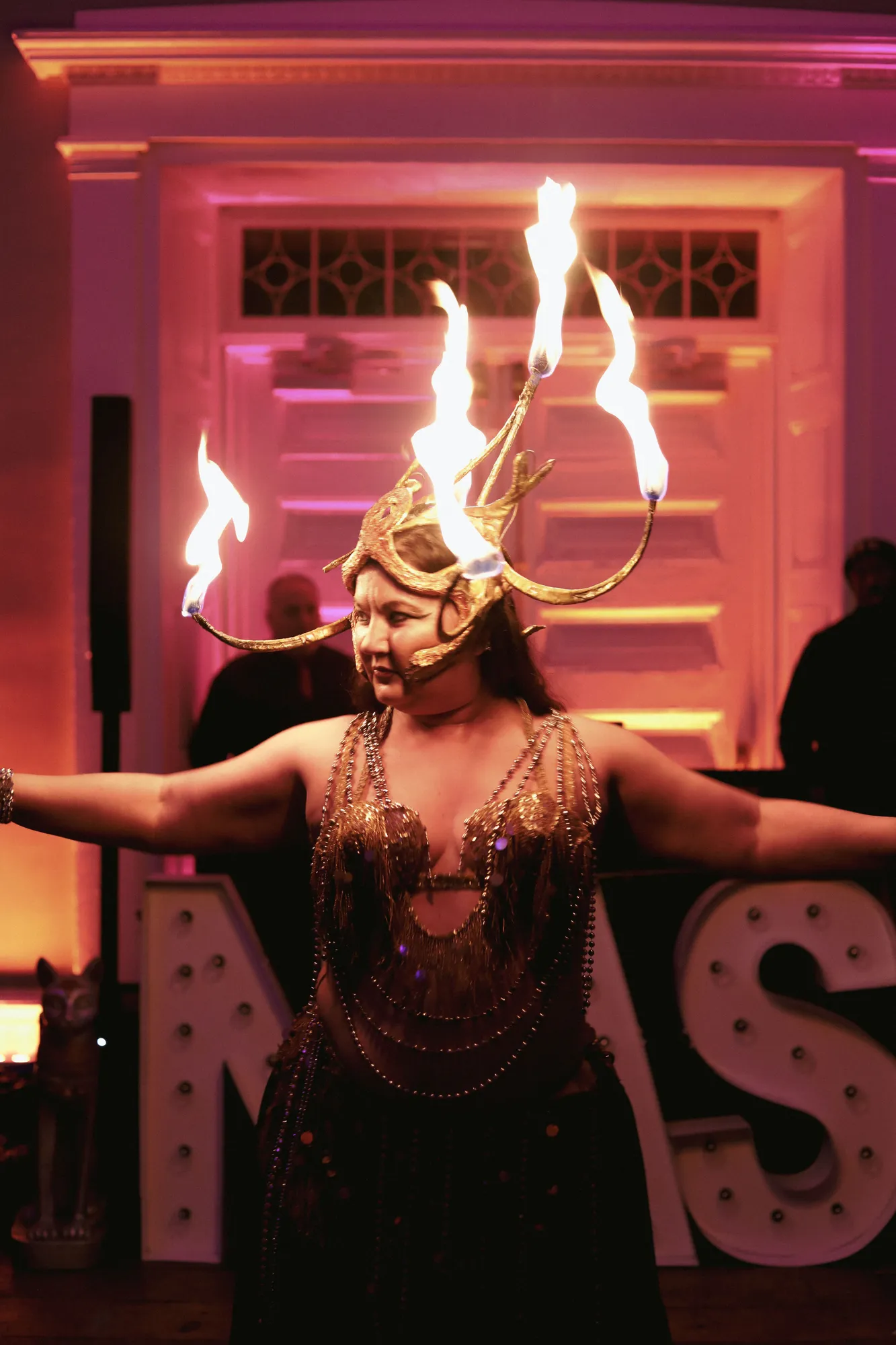 Lorenda performing with fire at a wedding celebration